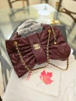 burgundy bow style bag
